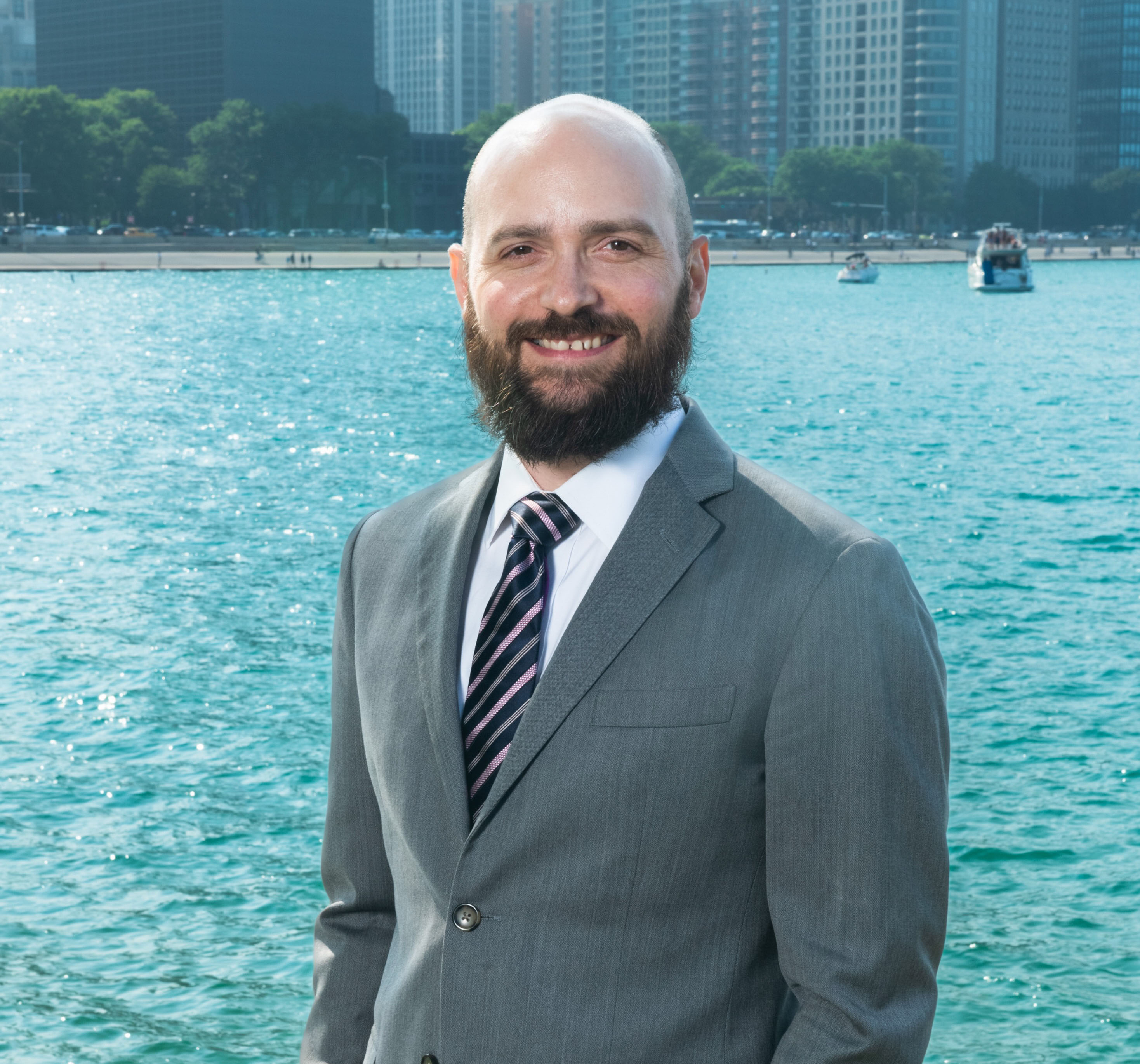 Andrew Berry the professor stands by the lake